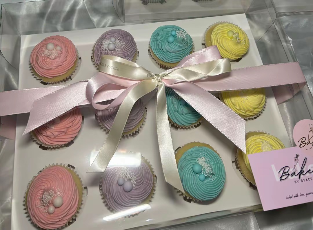 Cupcakes with pink and cream buttercream swirls